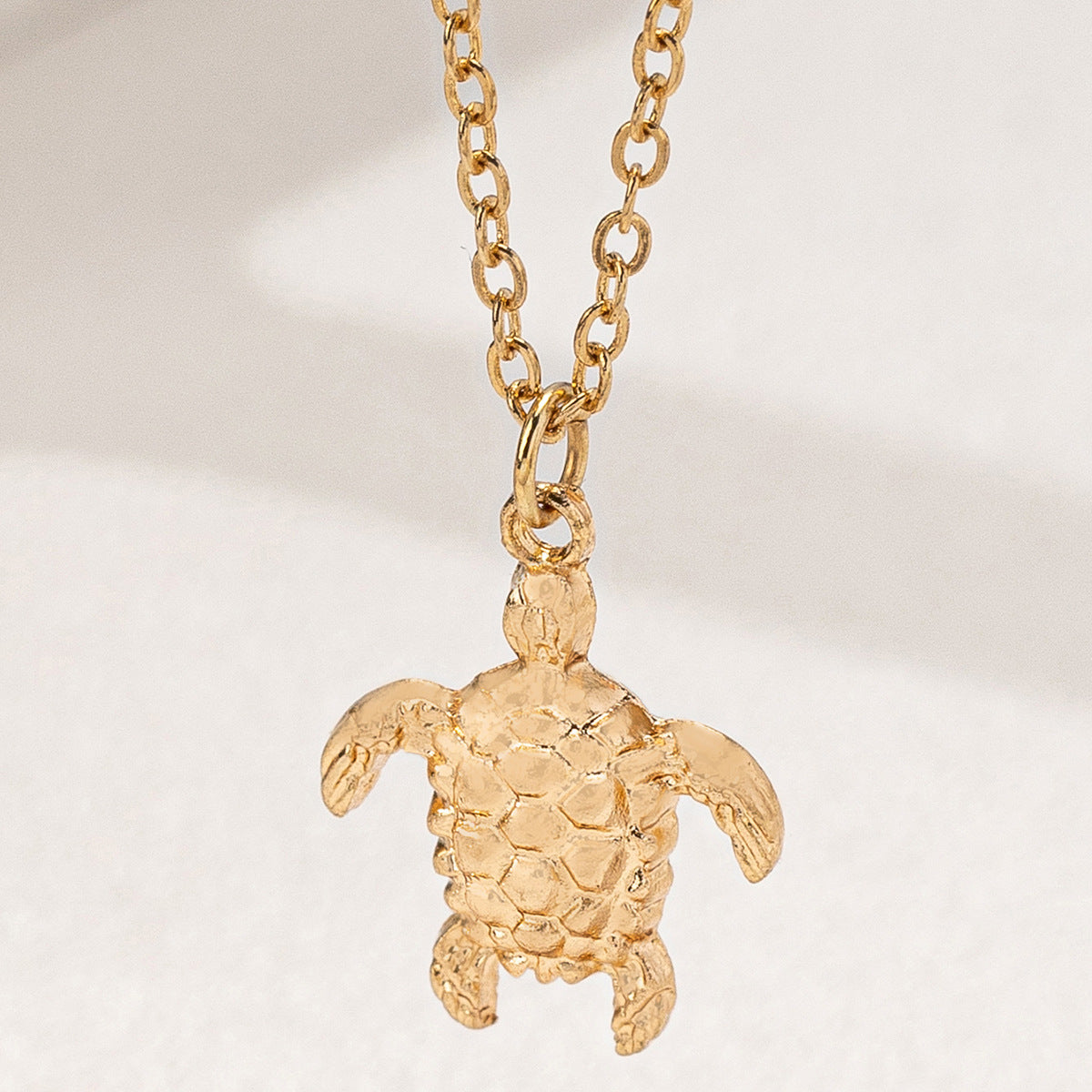 Tortoise Pendant Necklace For Women In Golden Alloy, Perfect For School Wear Featuring A Stylish Turtle Design