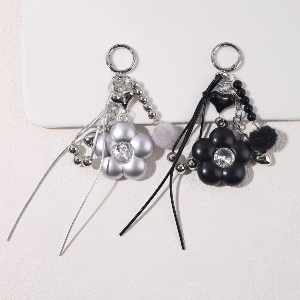 Dyed Black Flowers Bag Pendant With Diamond Inlay In Metal, Stylish Key Chain Accessory