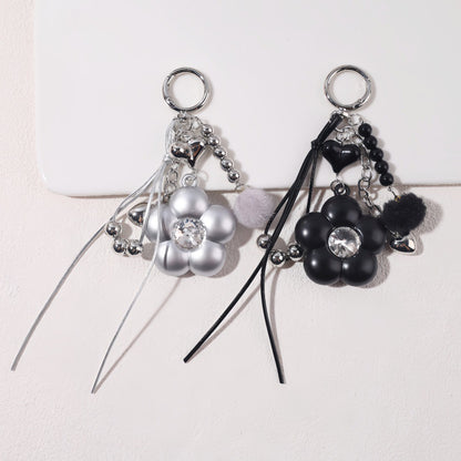 Dyed Black Flowers Bag Pendant With Diamond Inlay In Metal, Stylish Key Chain Accessory