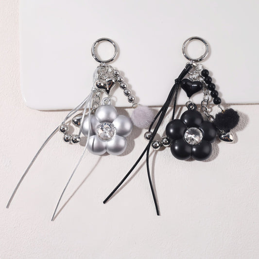 Dyed Black Flowers Bag Pendant With Diamond Inlay In Metal, Stylish Key Chain Accessory