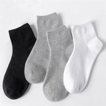 Unisex Casual Solid Color Socks In Dyed Black, Made With Comfortable Polyester Cotton For Spring Wear