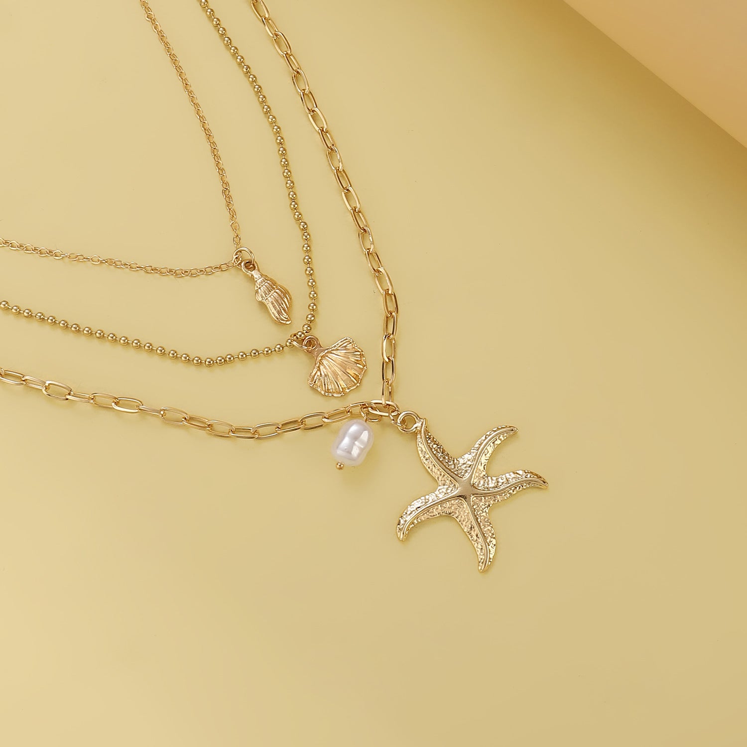Retro Three Layer Shell Necklace For Women In Gold Featuring KC Golden Plated Alloy Pendant