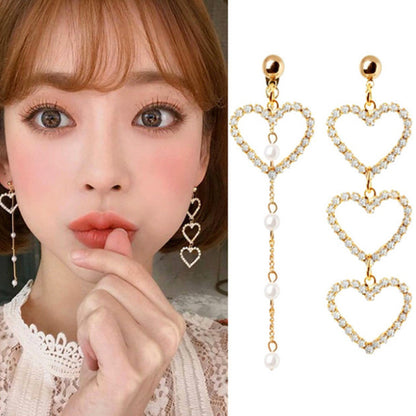Heart Shape Asymmetrical Earrings In Gold Alloy With Electroplated Finish And Rhinestone Inlay