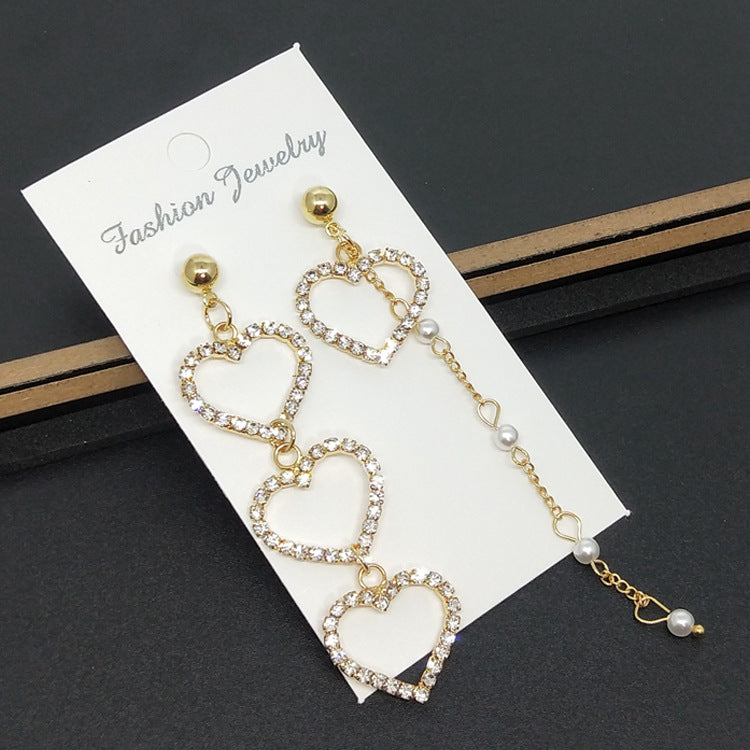 Heart Shape Asymmetrical Earrings In Gold Alloy With Electroplated Finish And Rhinestone Inlay