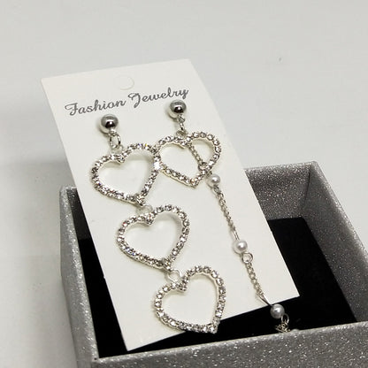 Heart Shape Asymmetrical Earrings In Gold Alloy With Electroplated Finish And Rhinestone Inlay