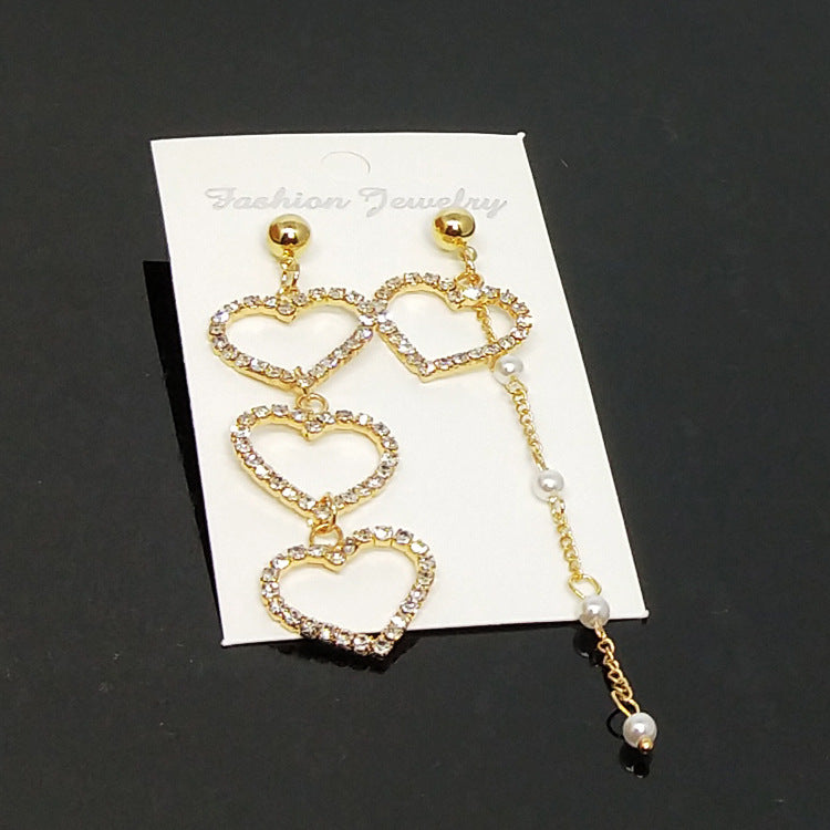 Heart Shape Asymmetrical Earrings In Gold Alloy With Electroplated Finish And Rhinestone Inlay