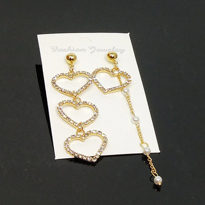 Heart Shape Asymmetrical Earrings In Gold Alloy With Electroplated Finish And Rhinestone Inlay