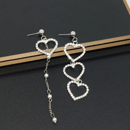 Heart Shape Asymmetrical Earrings In Gold Alloy With Electroplated Finish And Rhinestone Inlay
