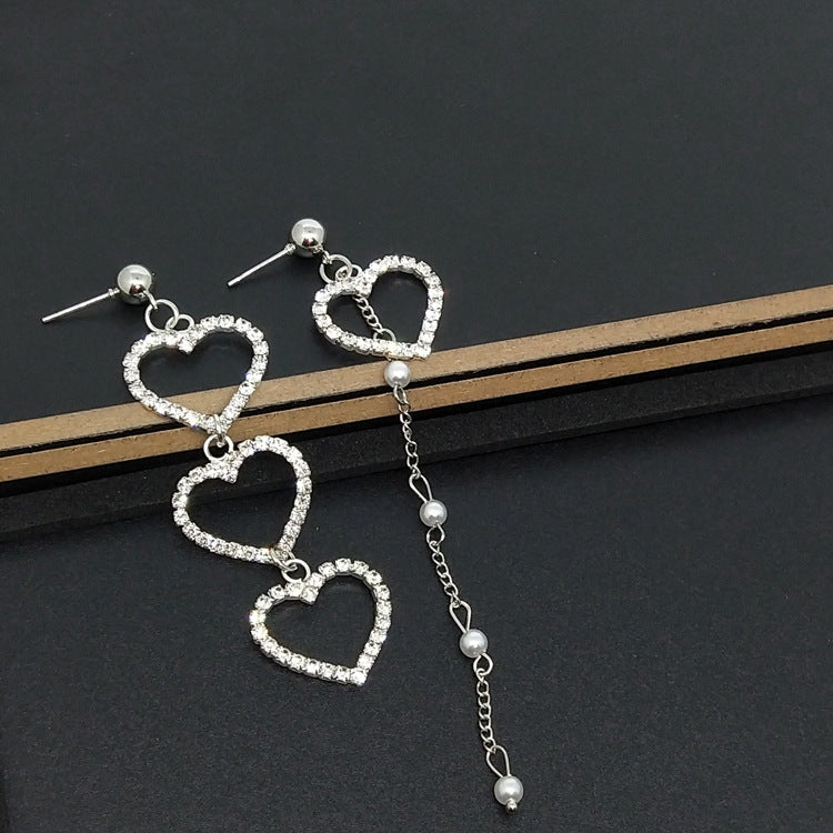 Heart Shape Asymmetrical Earrings In Gold Alloy With Electroplated Finish And Rhinestone Inlay