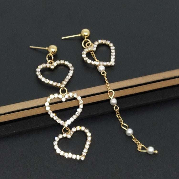Heart Shape Asymmetrical Earrings In Gold Alloy With Electroplated Finish And Rhinestone Inlay