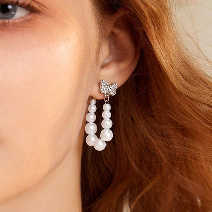 Sweet Silver Bow Tie Stud Earrings For Women With Elaborate Design And Artificial Pearl Inlay In Alloy