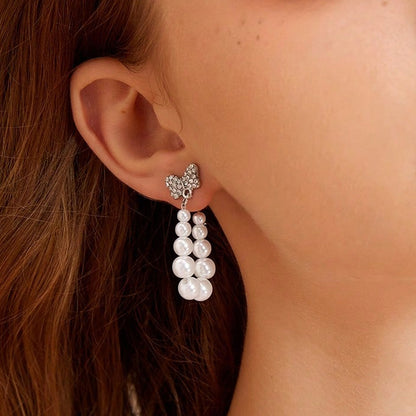 Sweet Silver Bow Tie Stud Earrings For Women With Elaborate Design And Artificial Pearl Inlay In Alloy