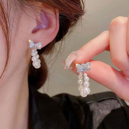 Sweet Silver Bow Tie Stud Earrings For Women With Elaborate Design And Artificial Pearl Inlay In Alloy