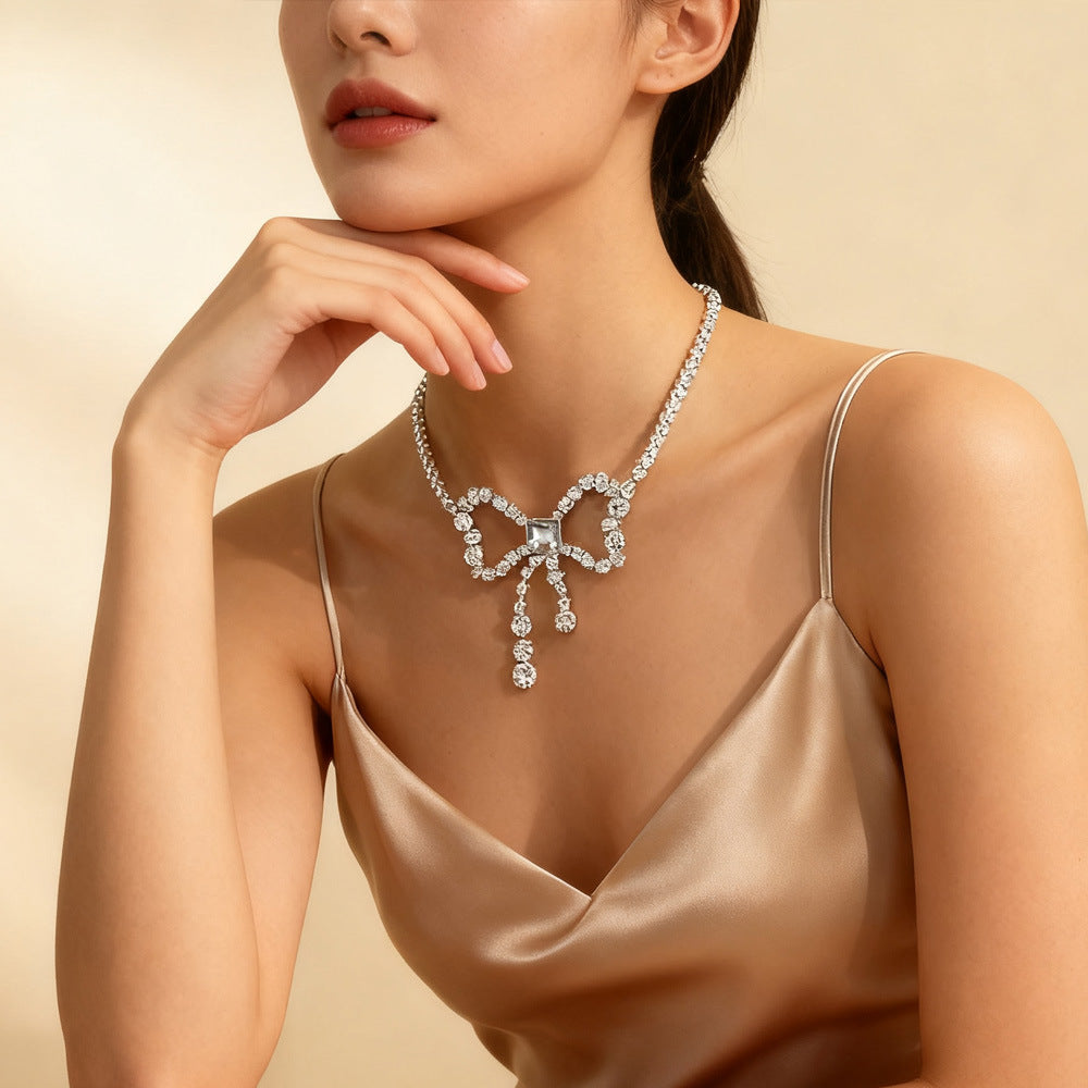 Silver Alloy Bow Tie Choker Necklace With Tassel, Electroplated Finish And Rhinestone Pendant For Women