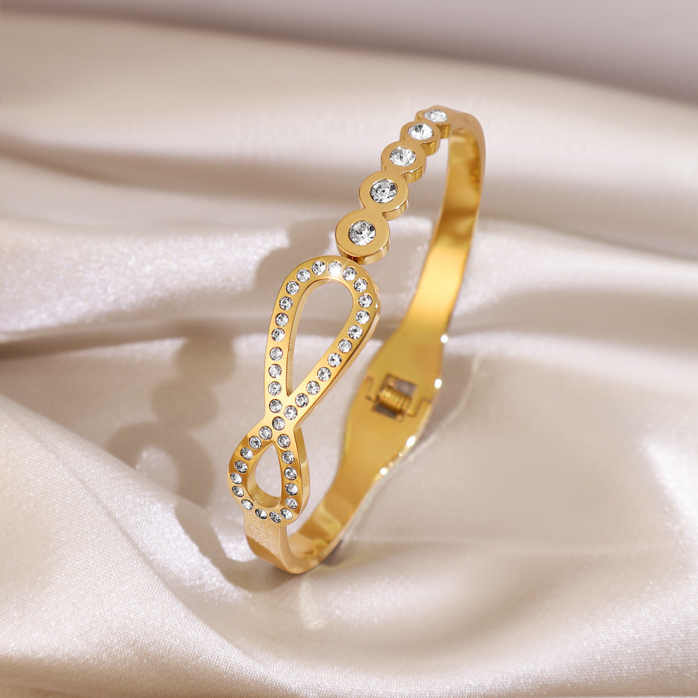 Infinity Pattern Titanium Steel Bangle With Zircon Inlay, Electroplated Gold Plating