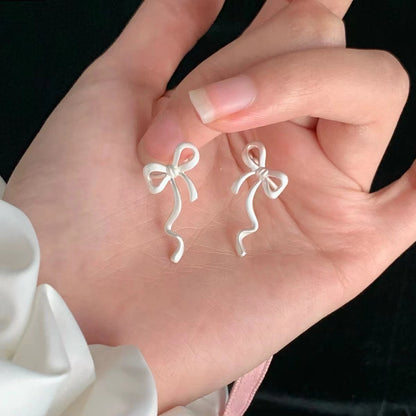 Sweet Bow Tie Clip Earrings For Women In Electroplated Alloy Finish