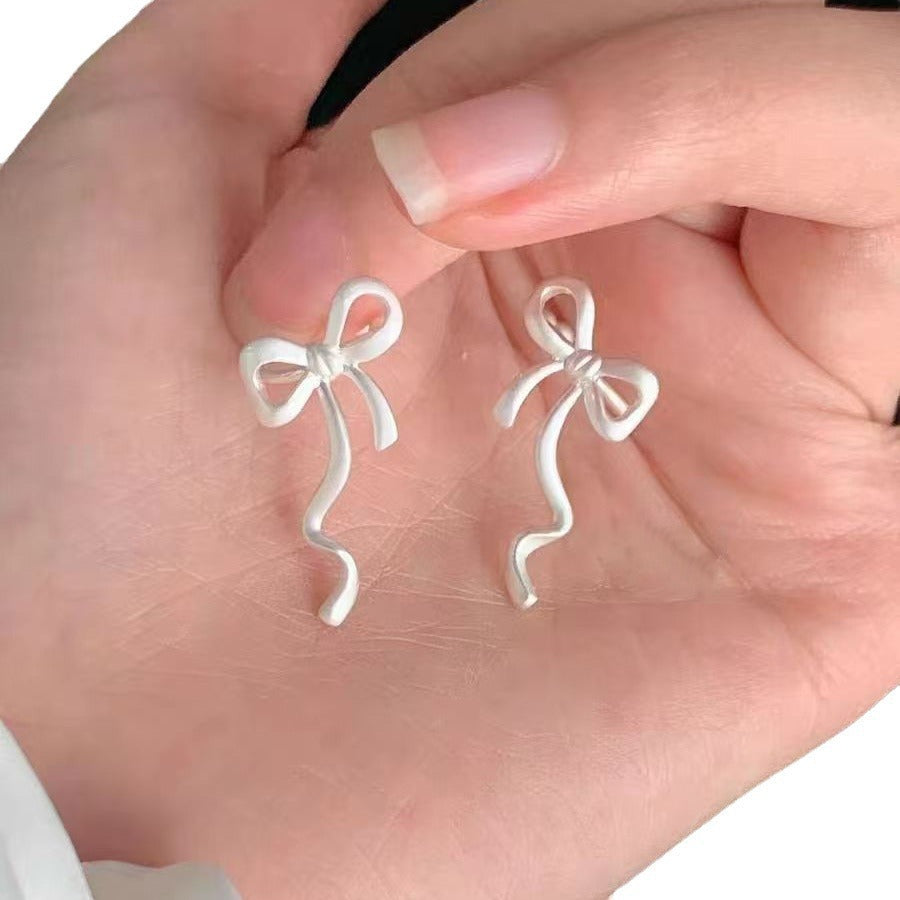 Sweet Bow Tie Clip Earrings For Women In Electroplated Alloy Finish