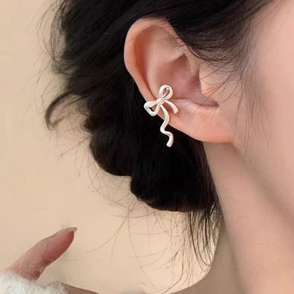 Sweet Bow Tie Clip Earrings For Women In Electroplated Alloy Finish