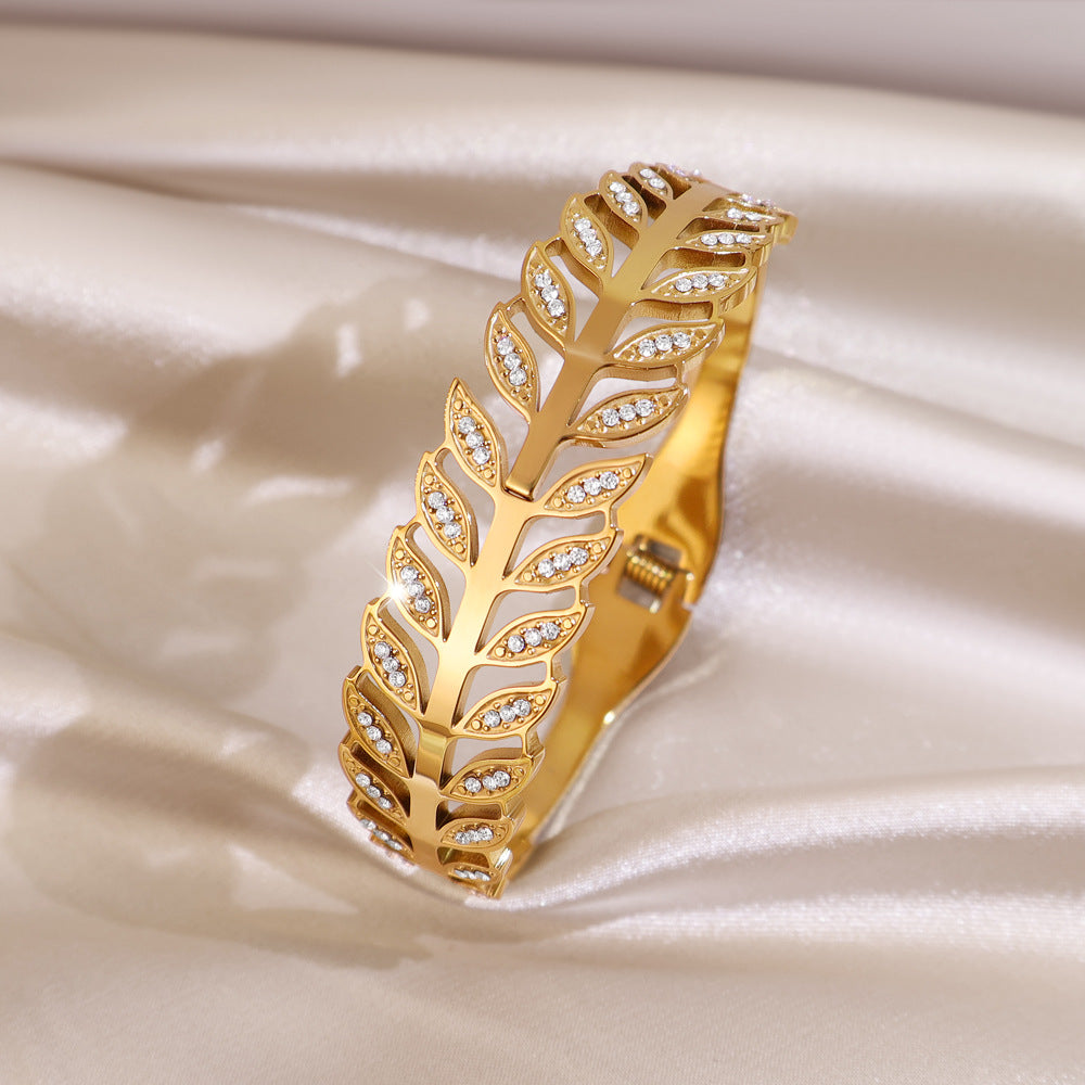 Exaggerated Stripe Bangle In Gold Titanium Steel With Electroplated Finish