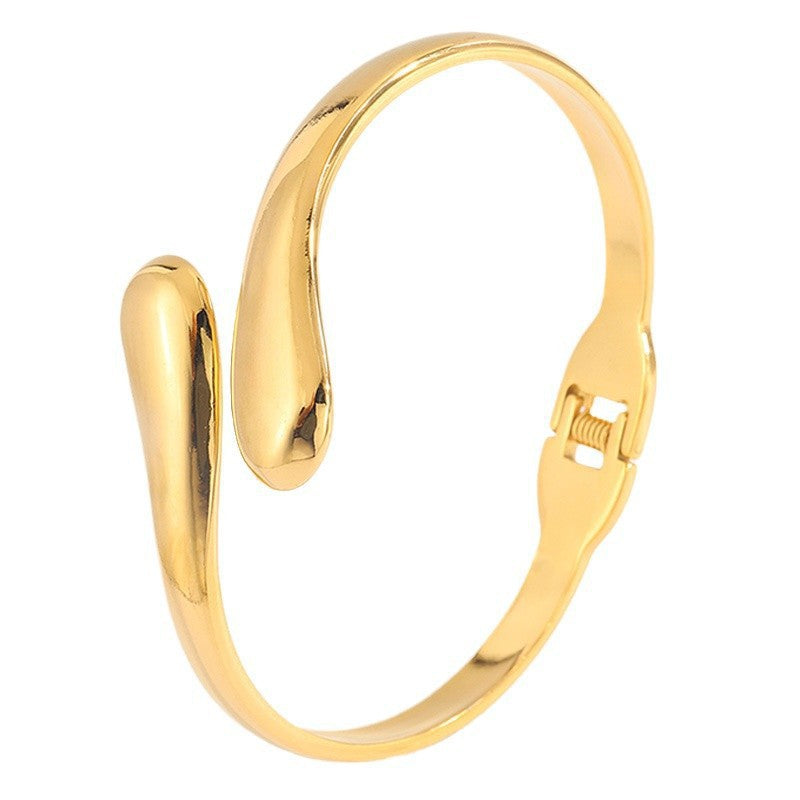 Double Ring Bangle In Titanium Steel With 18K Real Gold Electroplated Finish, Featuring Spring Ring Trigger Clasp Closure In Gold