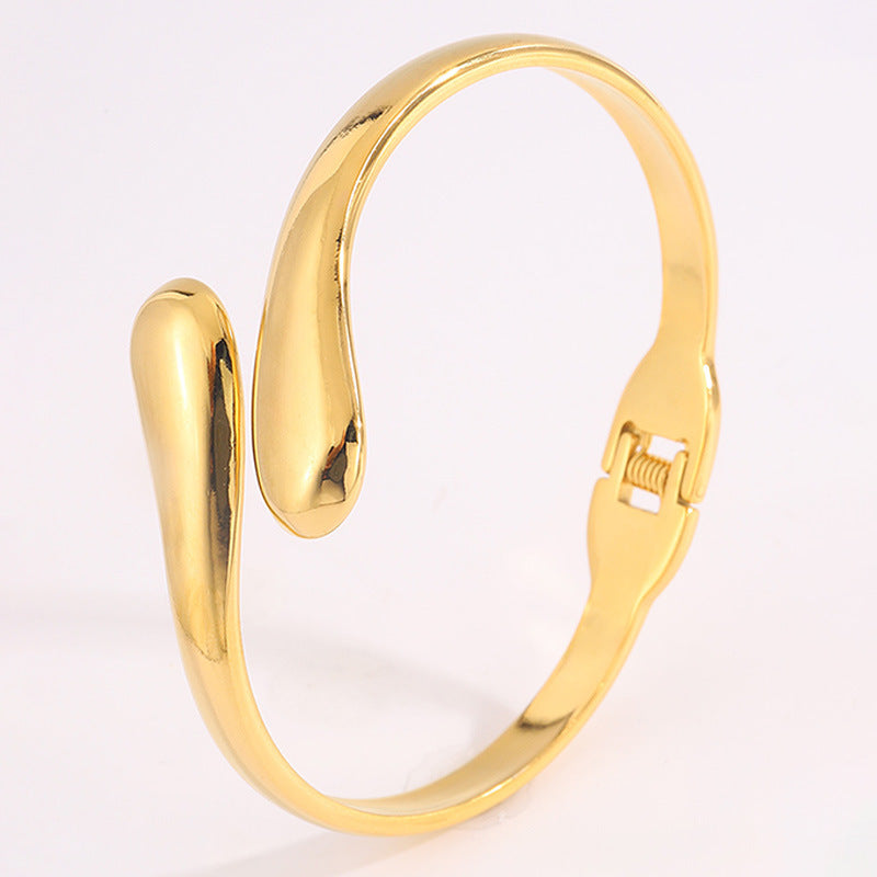 Double Ring Bangle In Titanium Steel With 18K Real Gold Electroplated Finish, Featuring Spring Ring Trigger Clasp Closure In Gold
