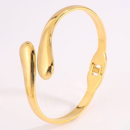 Double Ring Bangle In Titanium Steel With 18K Real Gold Electroplated Finish, Featuring Spring Ring Trigger Clasp Closure In Gold