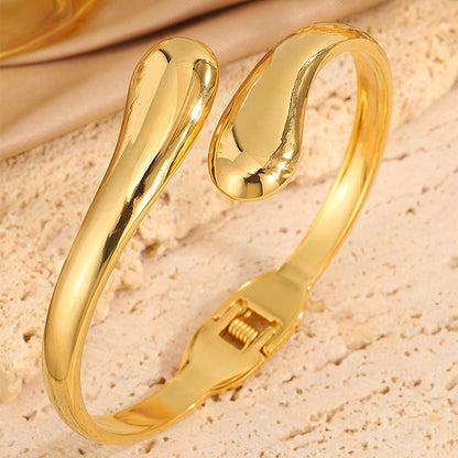 Double Ring Bangle In Titanium Steel With 18K Real Gold Electroplated Finish, Featuring Spring Ring Trigger Clasp Closure In Gold
