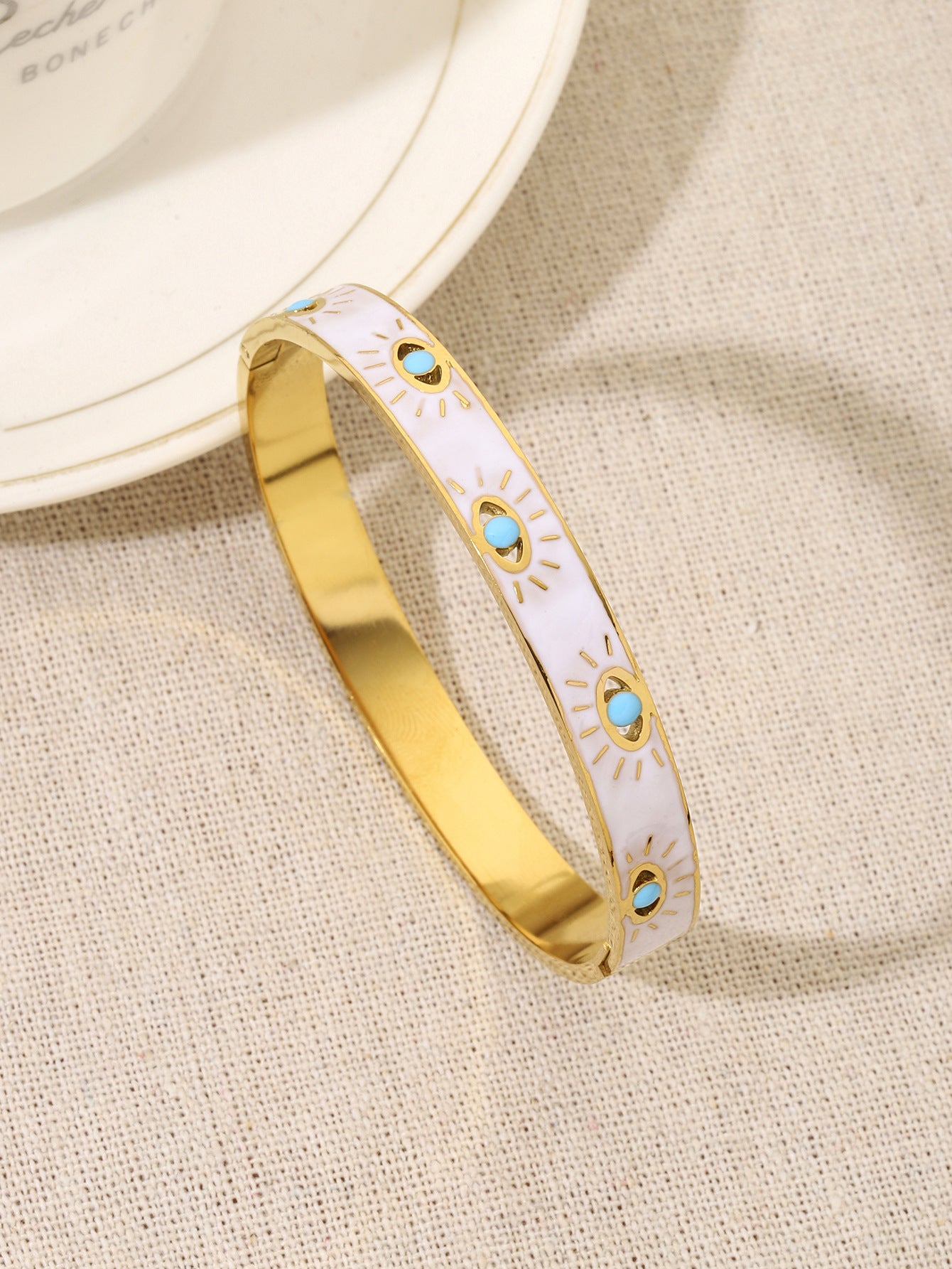 Novelty Eye Bangle For Women In Gold Titanium Steel With Electroplated Gold Plating