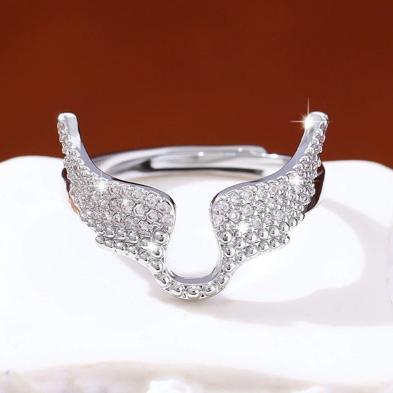 Angel Wings Ring For Women In Copper With Golden Plated Electroplated Finish Featuring Zircon Inlay