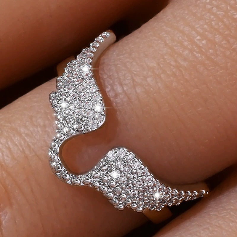Angel Wings Ring For Women In Copper With Golden Plated Electroplated Finish Featuring Zircon Inlay
