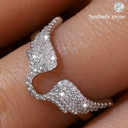 Angel Wings Ring For Women In Copper With Golden Plated Electroplated Finish Featuring Zircon Inlay