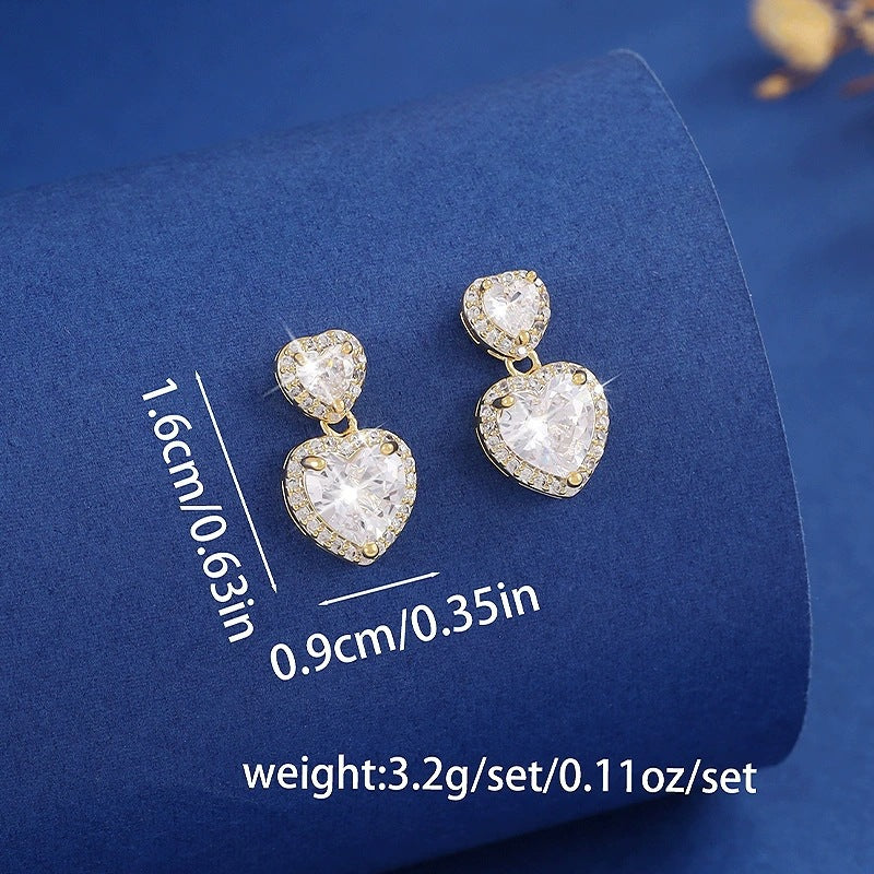 Sweet Heart Shape Stud Earrings For Women In Gold With Bezel Setting And Zircon Inlay, Made Of Copper