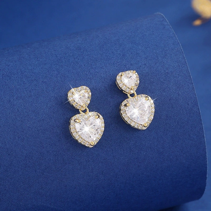 Sweet Heart Shape Stud Earrings For Women In Gold With Bezel Setting And Zircon Inlay, Made Of Copper