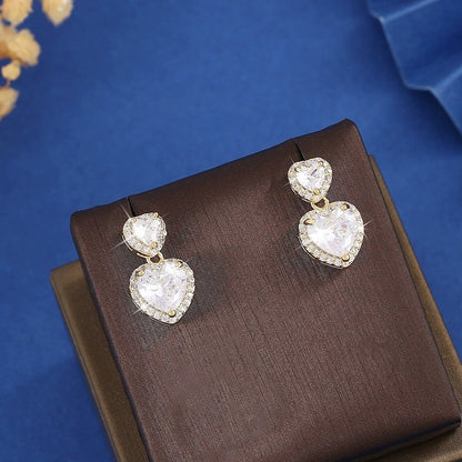 Sweet Heart Shape Stud Earrings For Women In Gold With Bezel Setting And Zircon Inlay, Made Of Copper