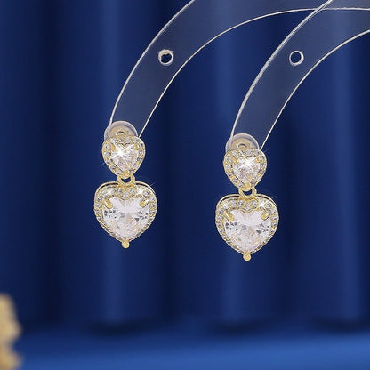 Sweet Heart Shape Stud Earrings For Women In Gold With Bezel Setting And Zircon Inlay, Made Of Copper