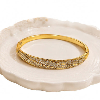 Geometric Twist Bangle In Gold Electroplated Copper Featuring Zircon Inlay
