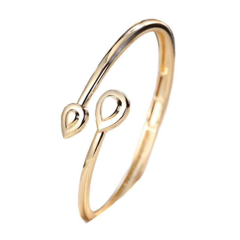Basic Water Droplets Bangle In Gold With Electroplated Copper Material