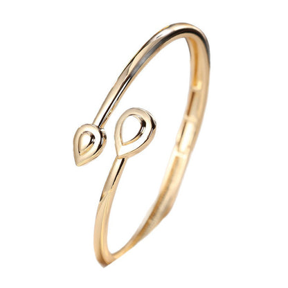 Basic Water Droplets Bangle In Gold With Electroplated Copper Material