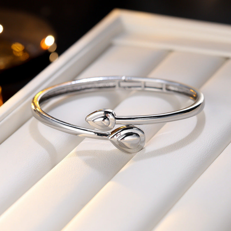 Basic Water Droplets Bangle In Gold With Electroplated Copper Material
