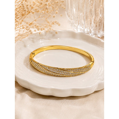 Geometric Twist Bangle In Gold Electroplated Copper Featuring Zircon Inlay