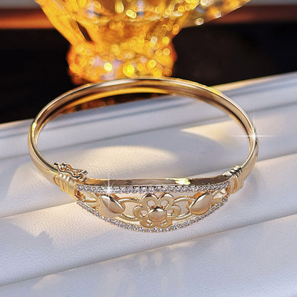 Sweet Flowers Bangle For Women In Gold Electroplated Copper