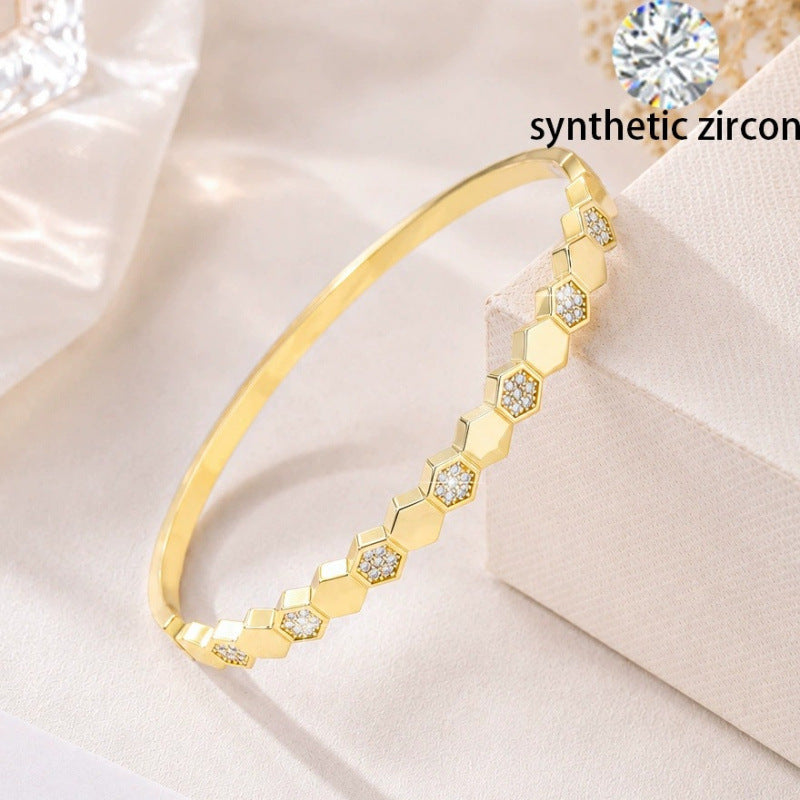 Elegant Honeycomb Bangle In Electroplated Copper Featuring A Stylish Gold Plating Process