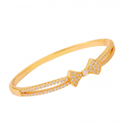 Bow Tie Bangle In Copper With Electroplated Gold Plating Featuring Rhinestone Inlay