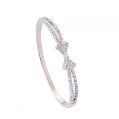 Bow Tie Bangle In Copper With Electroplated Gold Plating Featuring Rhinestone Inlay