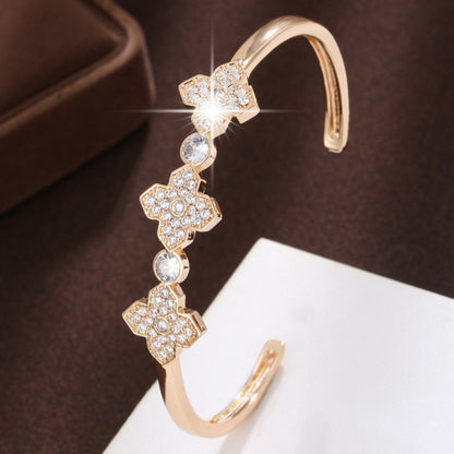 Electroplated Gold Copper Bangle With Zircon Inlay Featuring Elegant Flowers Design