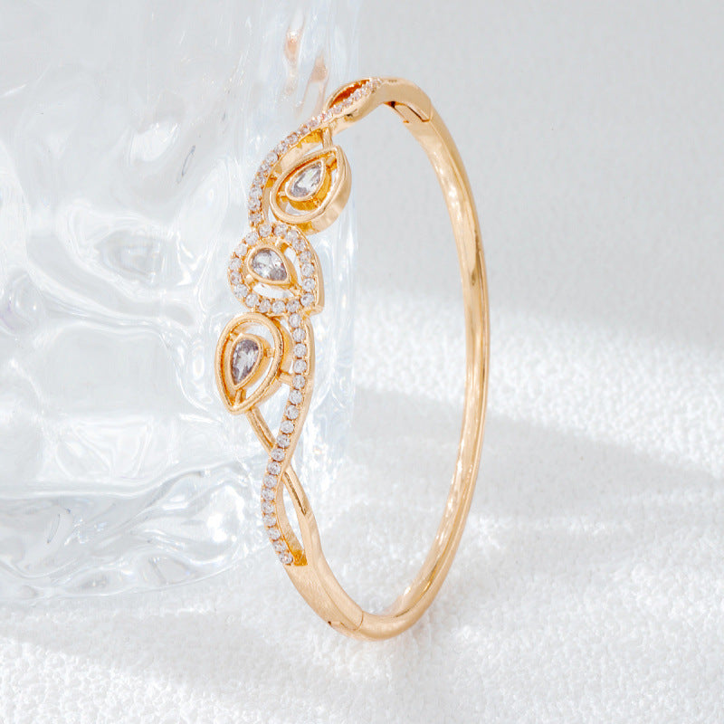 Irregular Inlay Copper Bangle For Women With Electroplated Golden Plated Finish And Zircon Inlay