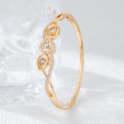Irregular Inlay Copper Bangle For Women With Electroplated Golden Plated Finish And Zircon Inlay