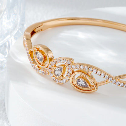 Irregular Inlay Copper Bangle For Women With Electroplated Golden Plated Finish And Zircon Inlay