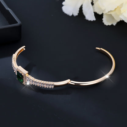Golden Plated Copper Bangle With Electroplated Finish Featuring May Birthstone Emerald Zircon Inlay