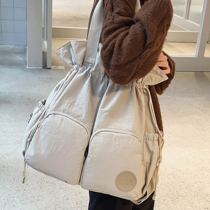 Solid Color Nylon Functional Backpack For Women With Sewing Thread Detail, Double Shoulder Straps, Ideal For Spring And Summer
